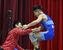 レスリング少年男子フリースタイル60キロ級決勝　優勝を決めた足大付高の与那城（右）が青木監督の元に駆け寄る＝佐賀県嬉野市中央体育館