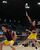 バドミントン男子優勝決定戦　宇南の佐藤（右）がスマッシュを放つ。左は岡島＝日環アリーナ栃木
