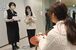 県庁15階の専用スタジオでスマートフォンを使ってショート動画を撮影する県職員ら＝24日午後、県庁