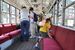 公開された路面電車の中を見学する観光客