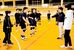 福田克典さん（右から２人目）や社会人クラブのメンバーが中学生の指導にあたる西条バレーボールアカデミーの活動＝１月、愛媛県西条市周布