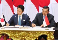 防衛協力拡大の協定に署名