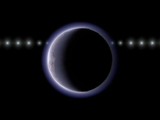 　太陽系外縁天体２００２ＸＶ９３（中央）が恒星の手前を通過する様子の想像図。天体の近くで恒星が減光している（国立天文台提供）