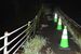 ため池脇の歩道の一部が崩落した現場＝６日午後７時30分、那須烏山市南大和久