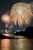 夜空や渡良瀬川の川面を彩る花火＝３日午後８時10分、足利市通４丁目（13秒間露光）