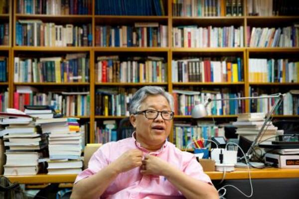 「シオン教会」の創設者で牧師の金明日氏=2018年8月、北京(AP=共同)