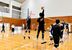 愛媛県新居浜市の男子バレーボールクラブ「新居浜クラブユース」。市内の中学生部員が参加し、教職員ＯＢや社会人チームの選手から指導を受ける＝２月、同市の金栄小学校