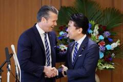 小泉氏、安保文書改定を伝達