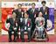 アジア・アジアパラ競技大会を記念した貨幣の打ち初め式で、写真に納まる愛知県の大村秀章知事(前列中央)ら=8日午後、大阪市の造幣局