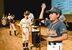 抽選後、くじの番号を会場内に発表する各チームの主将たち＝20日午後３時５分、県教育会館