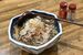 看板メニューの「山形の肉そば」。七味をかけて味変するのもお勧め
