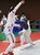 フェンシング成年女子エペ決勝　激しく攻める本県チームの国谷（右）＝上三川町体育センター