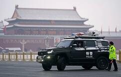 中国、GDP目標引き下げ