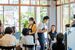 三重県伊勢市で開催された「注カフェ」で客と交流する若者たち（中央）＝２０２２年７月（奥村さん提供）