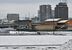 雪景色の中、運行するライトライン＝８日午前９時５分、宇都宮市下平出町