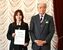 福田知事（右）から県文化財オフィサーの委嘱状を受け取った相川さん＝16日午前、県庁昭和館