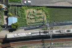 事故に警鐘「生」の花文字