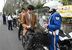 自転車で下校中の高校生に交通安全を呼びかける警察官ら＝25日午後、宇都宮市桜３丁目