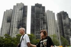 １６８人死亡香港火災、７人起訴