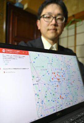 市内24カ所の子ども食堂の場所を表示するマップと高橋さん
