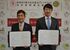 協定書を取り交わした早川市長（左）と藤本社長