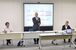 県道路啓開計画の改定について説明する横尾県土整備部長(中央)=1日午後、県庁北別館