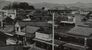 １９５７年度の市勢要覧にある旧佐野市の中心市街地。右上に当時の市庁舎や議事堂が見える（佐野市提供）