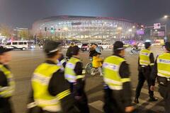 サッカー日中戦で厳重警備