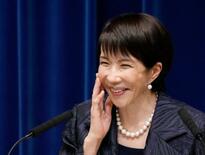 高市首相、力強さアピール笑みも