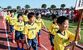 秋空の下、堂々と入場行進する選手たち＝12日午前８時45分、真岡ハイトラ運動公園陸上競技場