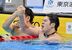 男子100メートルバタフライ決勝を２位で終えた水沼（右）。１位の松元と握手し、健闘をたたえ合う＝24日午後６時40分、東京アクアティクスセンター